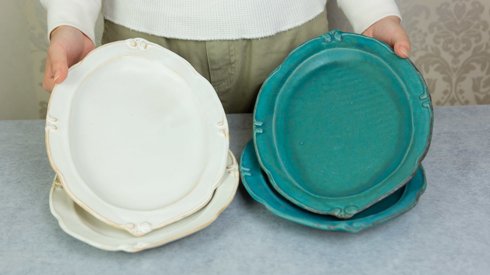 woman-hold-two-plates-of-four
