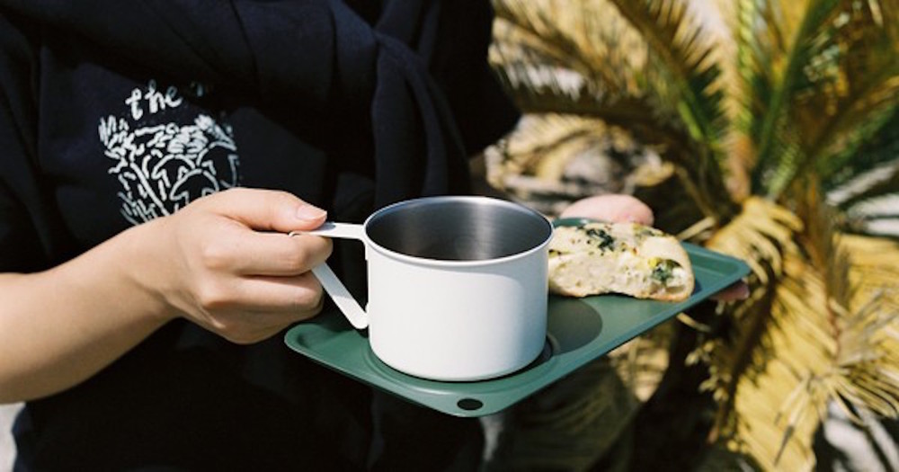 Thumb mini camping mug man is having